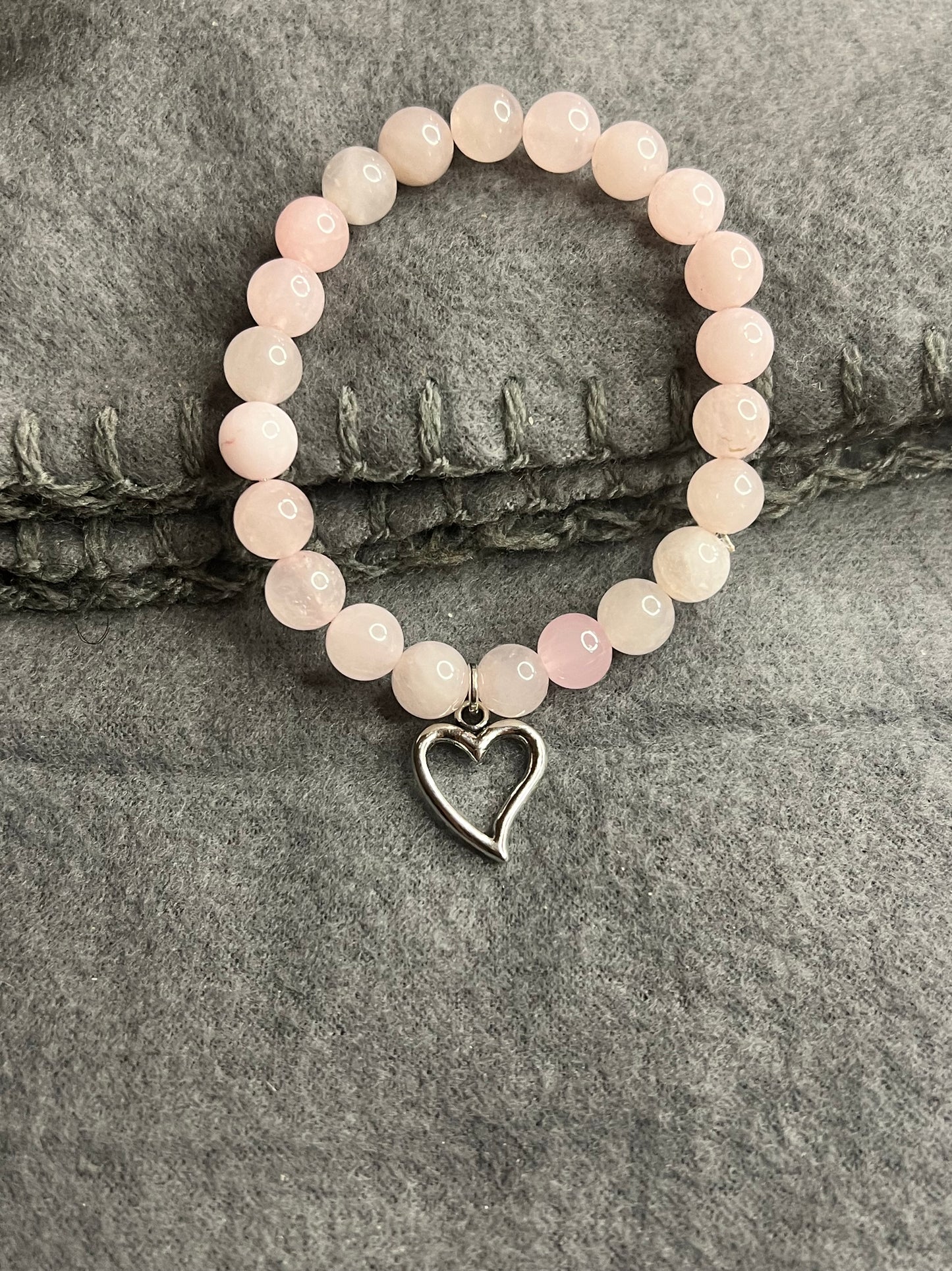 Rose Quartz Beaded Bracelet With Heart Charm.